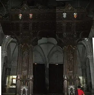 Armorial and ornate support for the organ in the Church of Saint-Léon-IX.