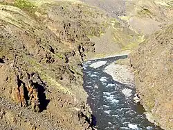The Heiðará river flowing through a steep, rocky gorge