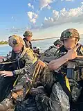 Ukrainian National Guardsmen onboard a RHIB with a SCAR-L