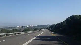 Route 784 between the Yodfat junction and the Rafael junction. In the background on the ridge are the buildings of Rafael.