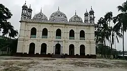 The mosque, painted in a creamy colour