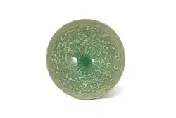 Goryeo ware bowl with chrysanthemum inscription. early 11th century, Goryeo dynasty.