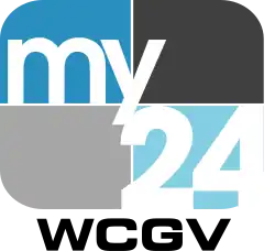 The MyNetworkTV logo, a 4:3 curved rectangle symbolic of a standard-definition television, divided into four quadrants of dark blue, black, gray, and light blue from left-to-right in both rows. Within the dark blue quadrant, "my" is rendered in lower-case text, while in the light blue quadrant, a white "24" appears. Below the logo, text reading "WCGV" appears in black.