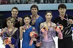 The pairs event medalists at the 2011 Cup of China
