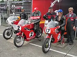 Winners Presentation 350 cc Junior Classic Race – Ian Moore (9), Chris Palmer (2) & Chris Swallow (17) TT Grandstand Tuesday 28 August 2012