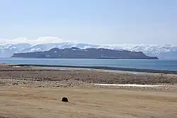 Þórðarhöfði seen from the mainland on a clear day