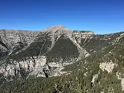 Mountain ridge with a treeless peak in the middle