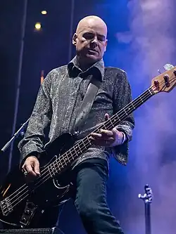 Adams performing with The Mission in 2015