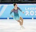 Regina Schermann begins to take off from the ice