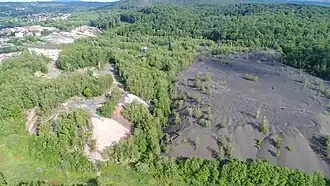 The red slag heap (Ronchamp) on the left and the black slag heap (Magny-Danigon) on the right.