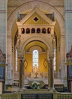The Ciborium in front of the altar, with statues of angels on the corners