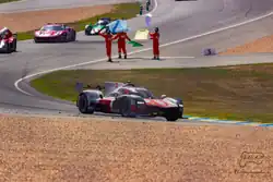The winning car, leading three others