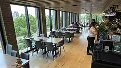 Main dining room in Owamni, with views of the Mississippi River and Pillsbury A-Mill