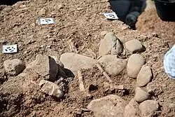 Part of a skeleton appears. Grave 103