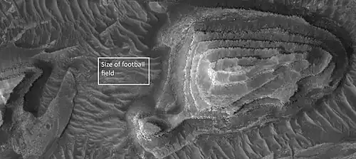 Layered mesa, as seen by HiRISE under HiWish program Box is the size of a football field.