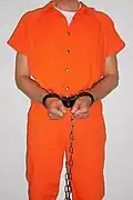 Inmate in ASP transport plus chain