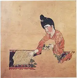 Painting of a woman playing Go, from the Astana Graves. Tang dynasty, c. 744 CE.