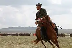 A Mongolian soldier performs during the opening ceremony for exercise Khaan Quest 2013 at the Five Hills Training Area in Mongolia, August 2013.