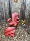 Red chair with foot rest for increased leisure