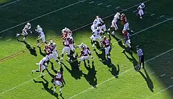 American football players during a play.