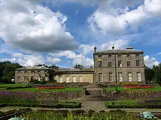A set of steps leading up to a country house