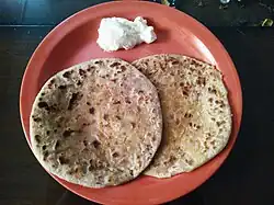 Punjabi Aloo paratha served with butter, from India