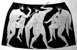 Black and white image: three bearded men dance energetically, holding wine-cups.