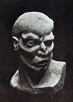 Andrew Dasburg, c. 1912, Lucifer, plaster of Paris, no. 647 of the catalogue. Dasburg extensively reworked by carving directly into a sculpture of a life-size plaster head by Arthur Lee.[32]