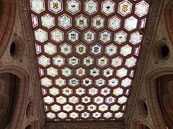 The Senate foyer ceiling, made in a Tudor-style stone tracery filled with stained glass.