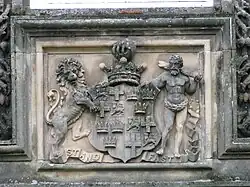 A carving of a coat of arms, showing the arms of the Earl of Seafield
