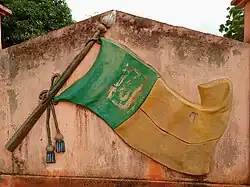 Faded mural depicting the national flag in Lissègazoun (2021)