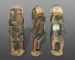 Male statuette wearing a penis sheath statement