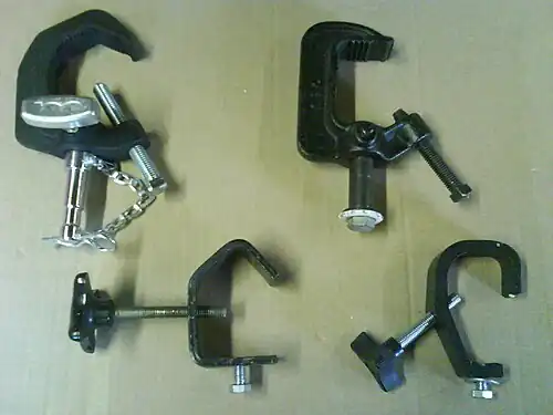 Assorted clamps, from top left: A baby pipe clamp, c-clamp, g-clamp, light duty c-clamp (sometimes called a "J" clamp).
