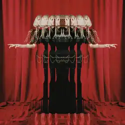 An edited photograph of Aurora that shows several reflections of her with a dark green dress, while standing on tiptoes. Behind her is a backdrop of red curtains that also cover the lower corner of the image.