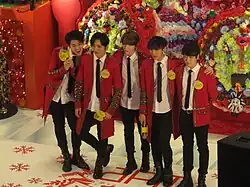 From left to right: Benji (former), Gunmin, J-Hoon, Heedo, Minpyo (former).