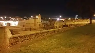 Night view of the exterior of the western flank