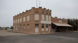 Former bank and community center southwest of the Stonewall County Courthouse in Aspermont, Texas