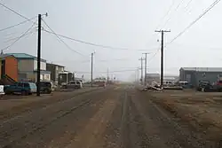 Street view of Utqiagvik in July 2008. Like all the others in Utqiaġvik, this street has been left unpaved due to the prevalence of permafrost.