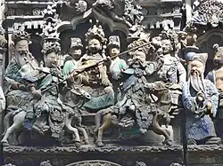 A scene from the roof of the temple shows actors depicting a duel between Guan Yu and another fighter