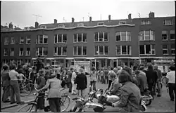 The public watches repaired windows, 1972.