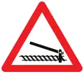 A41: Railroad crossing ahead with barriers