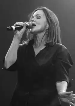 A woman singing into a microphone