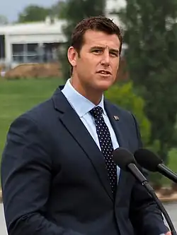 A picture of Ben Roberts-Smith speaking at the 2015 National Flag Raising and Citizenship Ceremony