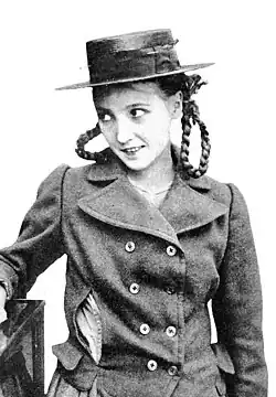 Young woman in a straw hat and braids