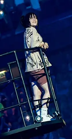 Eilish atop a crane, performing for a 2022 world tour