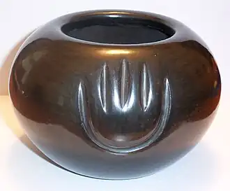 Black bowl with bear paw by Angela Baca, Santa Clara Pueblo