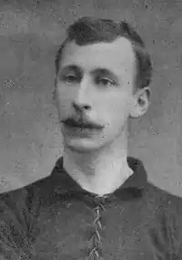 A man wearing a football shirt.