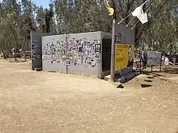 Bomb shelter at the site decorated with memorial posters