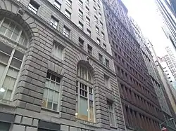 The brick facade of the original structure, next to the limestone facade of the expanded building