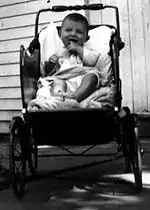 A baby in a buggy, United States, 1935